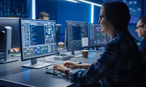Smart,Female,It,Programer,Working,On,Desktop,Computer,In,Data